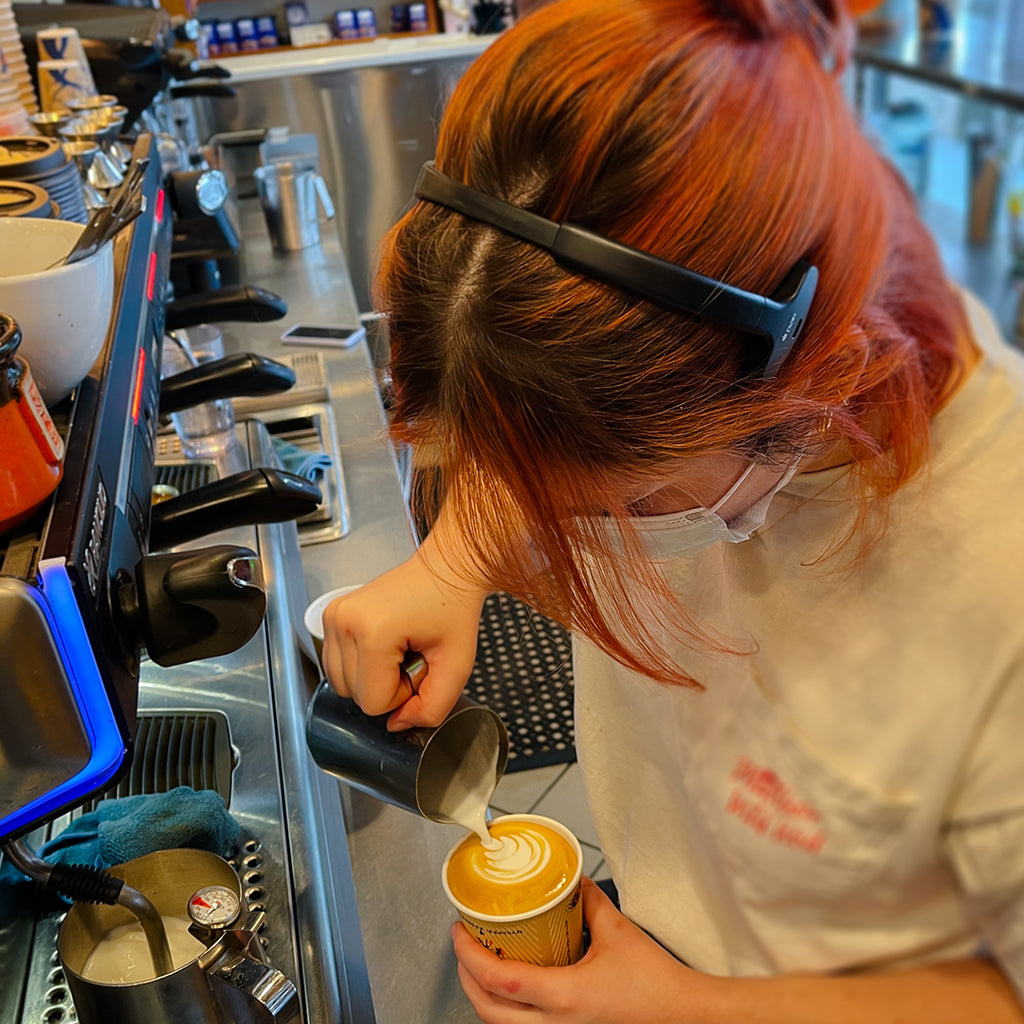 staff creating latte art